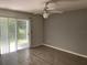 Spacious living room with sliding door to patio at 2022 Royal Bay Blvd # 93, Kissimmee, FL 34746