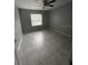 Spacious bedroom with tile floors and large window at 9817 Turf Way # 8, Orlando, FL 32837