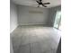 Living room with tile floors and access to balcony at 9817 Turf Way # 8, Orlando, FL 32837