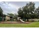 playground with play equipment and green space at 9817 Turf Way # 8, Orlando, FL 32837