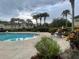 Relaxing community pool with comfortable seating and landscaping at 9817 Turf Way # 8, Orlando, FL 32837