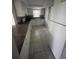 Galley kitchen with granite countertops and appliances at 9817 Turf Way # 8, Orlando, FL 32837