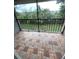 Private screened balcony overlooking a green space at 9817 Turf Way # 8, Orlando, FL 32837
