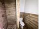 Modern bathroom with wood-look tile shower and toilet at 1413 45Th St, Orlando, FL 32839