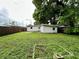 Large backyard with grassy area and garden space at 1413 45Th St, Orlando, FL 32839