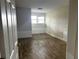Spacious bedroom featuring wood-look floors and window at 1413 45Th St, Orlando, FL 32839