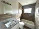 Updated bathroom with granite vanity and wood-look tile at 1413 45Th St, Orlando, FL 32839