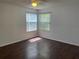 Bedroom with hardwood floors and a window at 2717 N Poinciana Blvd # 179, Kissimmee, FL 34746