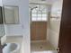 Bathroom with walk-in shower and large window at 2717 N Poinciana Blvd # 179, Kissimmee, FL 34746