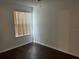 Well-lit bedroom featuring hardwood floors at 2717 N Poinciana Blvd # 179, Kissimmee, FL 34746