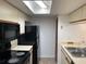 Kitchen with black appliances and double sink at 2717 N Poinciana Blvd # 179, Kissimmee, FL 34746