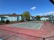 Community tennis court with surrounding fence at 2717 N Poinciana Blvd # 179, Kissimmee, FL 34746