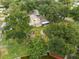 An aerial view showing a house with a large backyard near the water at 4401 Mesa Verde Dr, Saint Cloud, FL 34769