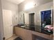 Bathroom with double vanity and granite countertop at 2305 Silver Palm Dr # 302, Kissimmee, FL 34747