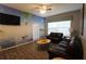 Living room with beach mural, leather sofas, and wood floors at 2305 Silver Palm Dr # 302, Kissimmee, FL 34747