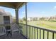 Screened balcony with patio furniture and view of grassy area at 2305 Silver Palm Dr # 302, Kissimmee, FL 34747
