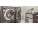 Laundry room with washer, dryer, and extra refrigerator at 6728 Huntleigh Hammock Rd, Harmony, FL 34773