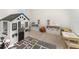Playroom featuring a playhouse, toys, and a table at 6728 Huntleigh Hammock Rd, Harmony, FL 34773