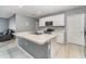 Island kitchen with stainless steel appliances and white cabinets at 6728 Huntleigh Hammock Rd, Harmony, FL 34773