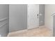 Light gray entryway with tile flooring and interior door at 6728 Huntleigh Hammock Rd, Harmony, FL 34773