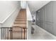 Staircase with carpet runner and safety gate at 6728 Huntleigh Hammock Rd, Harmony, FL 34773