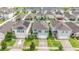 Aerial view of houses with lake and lush landscaping at 6728 Huntleigh Hammock Rd, Harmony, FL 34773