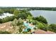 Community features resort-style pools, lush landscaping, and lake views at 1100 Lake Shadow Cir # 2101, Maitland, FL 32751