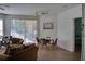 Bright living room with dining area, hardwood floors, and access to a patio at 1100 Lake Shadow Cir # 2101, Maitland, FL 32751