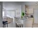 Open kitchen with breakfast bar and living room views at 1100 Lake Shadow Cir # 2101, Maitland, FL 32751