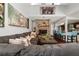 Open living room with sectional sofa, brick fireplace, and hardwood floors at 1105 Monroe Ave., St Cloud, FL 34769