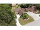 Aerial view of home, driveway, and lush landscaping at 1105 Monroe Ave., Saint Cloud, FL 34769