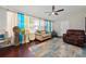 Sunroom features a comfortable seating area with a view of the backyard at 1105 Monroe Ave., St Cloud, FL 34769