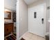 Inviting entryway with a coat closet and updated flooring at 1105 Monroe Ave., St Cloud, FL 34769