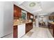 Updated kitchen with granite countertops, stainless steel appliances, and wood cabinets at 1105 Monroe Ave., St Cloud, FL 34769