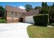 Two-story house with attached garage and manicured lawn at 1105 Monroe Ave., St Cloud, FL 34769