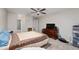 Spacious bedroom with double bed, dresser, and ensuite bathroom access at 1105 Monroe Ave., St Cloud, FL 34769