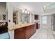 Kitchen with granite countertops, dark wood cabinets, and a breakfast bar at 1105 Monroe Ave., St Cloud, FL 34769