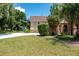 Well-maintained home with lush landscaping and a private driveway at 1105 Monroe Ave., St Cloud, FL 34769