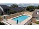 Community pool with lounge chairs and umbrellas at 1105 Monroe Ave., St Cloud, FL 34769