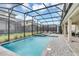 Large screened pool and spa with plenty of space for lounging at 4514 Narrative Ln, Kissimmee, FL 34746