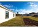 Newly built home with grassy backyard and partially fenced area at 1306 Congo Dr, Poinciana, FL 34759