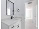 Modern bathroom with a single vanity and black matte faucet at 1306 Congo Dr, Poinciana, FL 34759