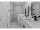 Clean bathroom with marble shower and double vanity at 1306 Congo Dr, Poinciana, FL 34759