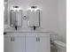 Modern bathroom with double vanity and marble shower at 1306 Congo Dr, Poinciana, FL 34759