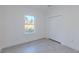 Simple bedroom with wood-look floors and closet at 1306 Congo Dr, Poinciana, FL 34759