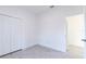 Spacious bedroom with double door closet and wood-look flooring at 1306 Congo Dr, Poinciana, FL 34759