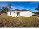 Rear view of house with covered patio at 1306 Congo Dr, Poinciana, FL 34759