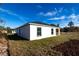View of house exterior and backyard at 1306 Congo Dr, Poinciana, FL 34759