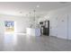 Modern kitchen with white cabinets, stainless steel appliances, and island at 1306 Congo Dr, Poinciana, FL 34759