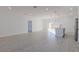Open concept kitchen with island and breakfast bar, light wood flooring, and modern appliances at 1306 Congo Dr, Poinciana, FL 34759
